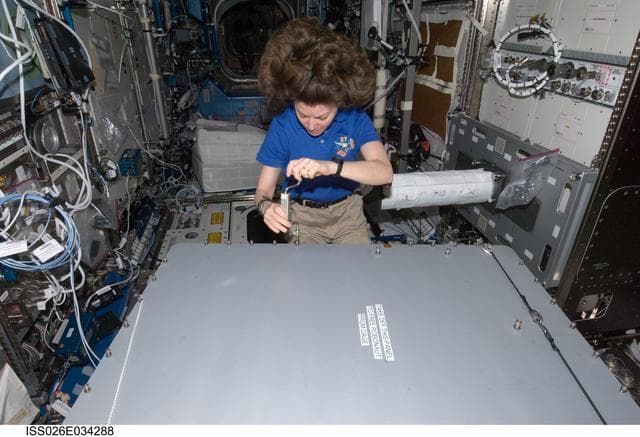 NASA image: Coleman opens Robonaut 2 Container in the U.S. Laboratory