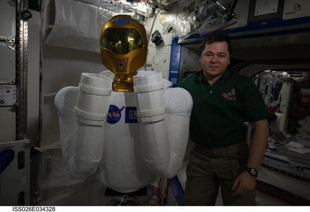NASA image: Skripochka poses with Robonaut 2