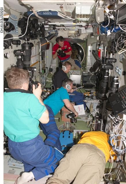 NASA image: Crewmembers in the SM during Progress 42P Docking