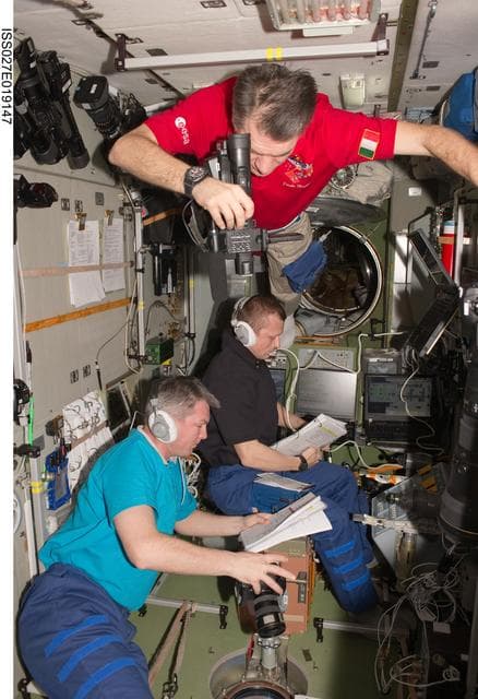NASA image: Crewmembers in the SM during Progress 42P Docking