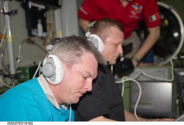 NASA image: Samokutyaev and Kondratyev in the SM during Progress 42P Docking