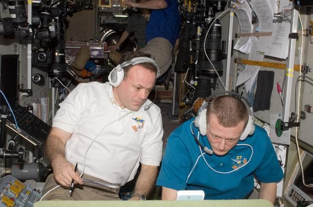 NASA image: Garan and Kondratyev during STS-134 approach in the SM