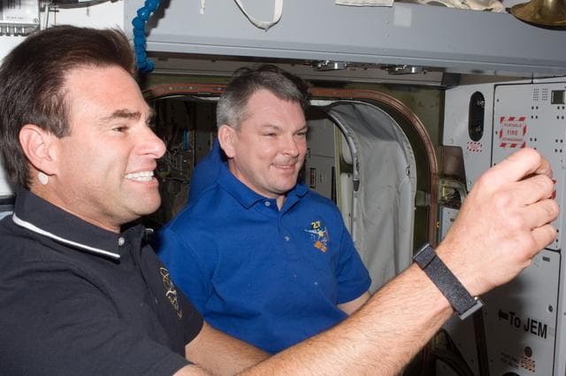 NASA image: Chamitoff and Samokutyaev in Node 2 following STS-134 Hatch Opening