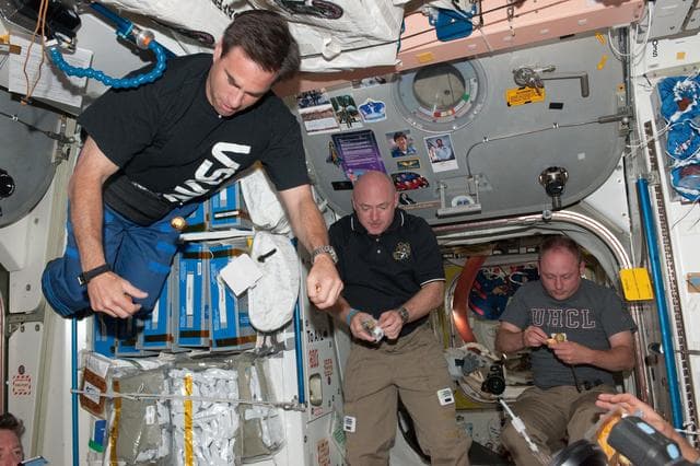NASA image: Expedition 27 and STS-134 Crewmembers share a meal in Node 1