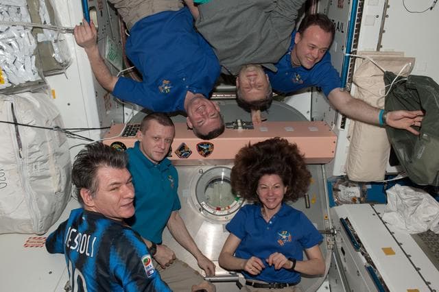 NASA image: Expedition 27 Crew poses with Mission Patch in Node 1
