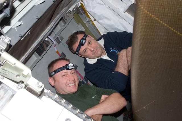 NASA image: View of STS-134 MS Fincke and Expedition 28 FE Garan posing for a photo during Joint Operations