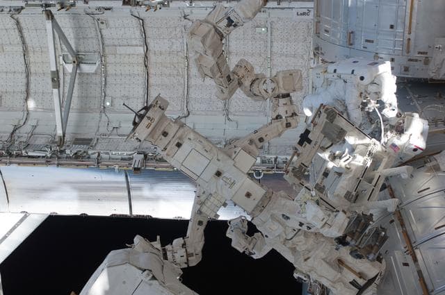 NASA image: View of STS-134 MS Feustel and Fincke working during EVA-3