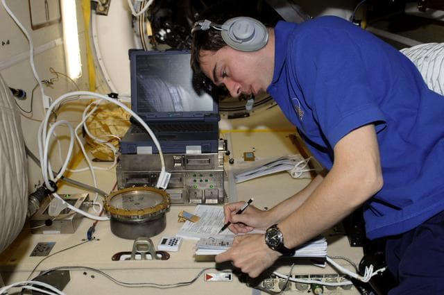NASA image: View of FE Volkov working with KPT-21 PK-3+ Plasma Crystal-3+ Payload