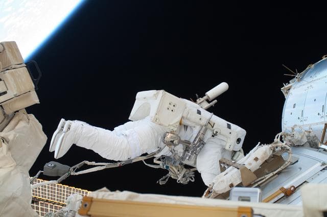 NASA image: View of FE Garan taken during a session of EVA