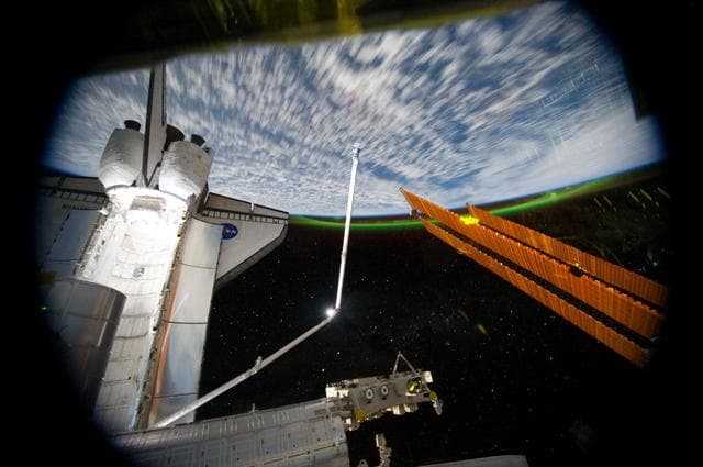 NASA image: Exterior view of ISS and Shuttle Atlantis
