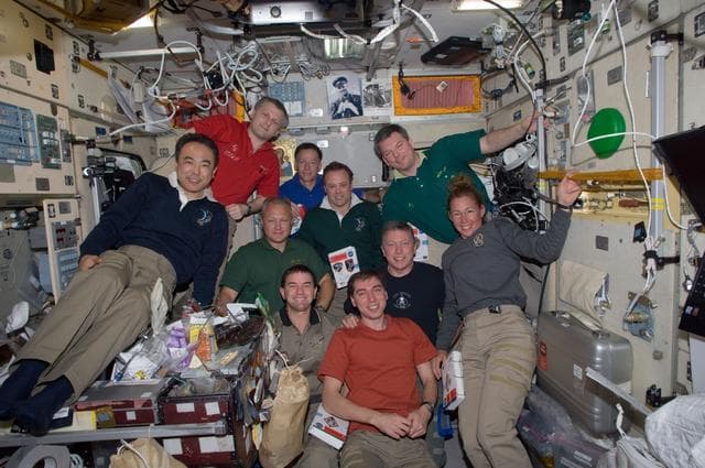 NASA image: Expedition 28 and STS-135 Crew Members pose for a photo Crew Portrait