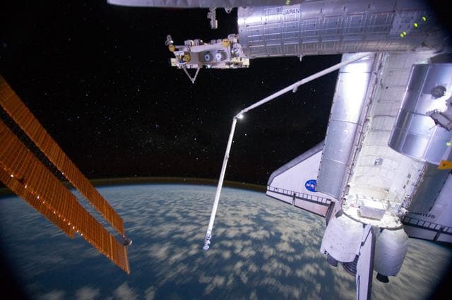 NASA image: View of ISS and Atlantis taken at Night