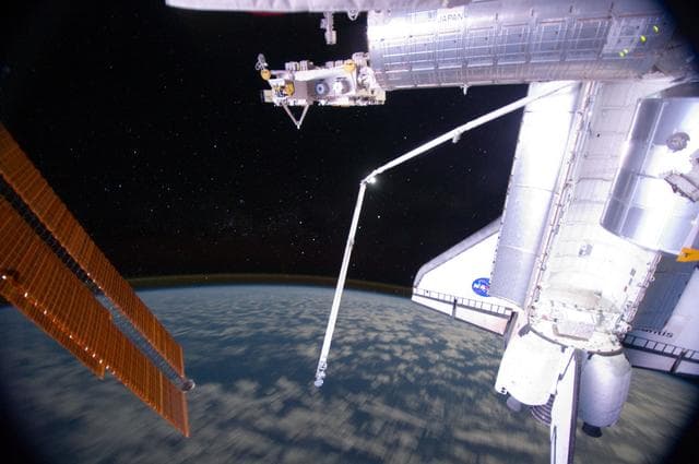 NASA image: View of ISS and Atlantis taken at Night