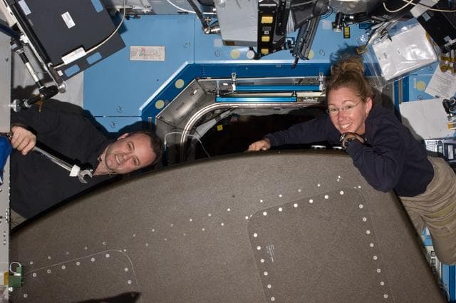 NASA image: Expedition 28 FE Garan and STS-135 MS Magnus pose for a photo in the US Lab