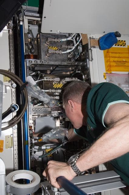 NASA image: Installing the ARFTA (Advanced Recycle Filter Tank Assembly)