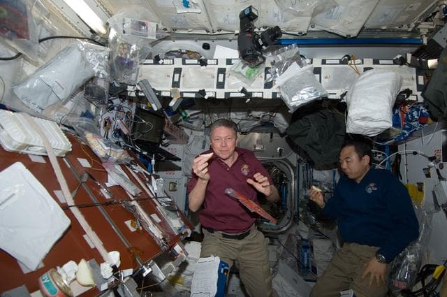 NASA image: Fossum and Furukawa with snack in Node 1