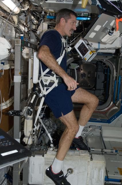 NASA image: Burbank exercises on the CEVIS in the U.S. Laboratory