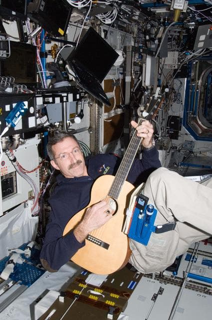 NASA image: Burbank plays a guitar in the U.S. Laboratory