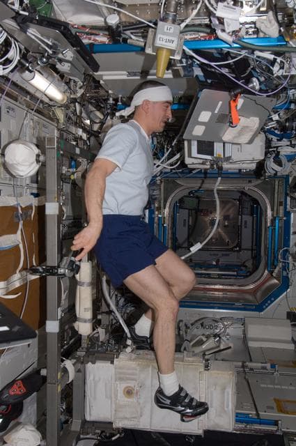 NASA image: Ivanishin exercises on the CEVIS in the U.S. Laboratory