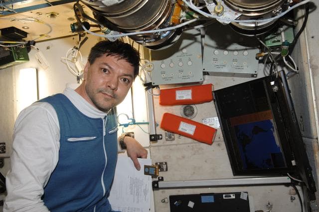 NASA image: Kononenko transfers Bioecology Kit from Soyuz to SM for stowage