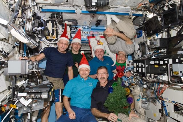 NASA image: Expedition 30 Crew Members celebrate Christmas in the U.S. Laboratory