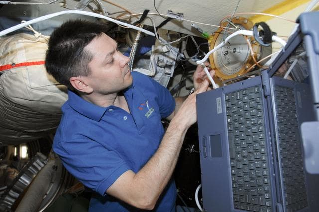 NASA image: Kononenko works with the KPT-21 PK-3+ Telescience Payment in the MRM2