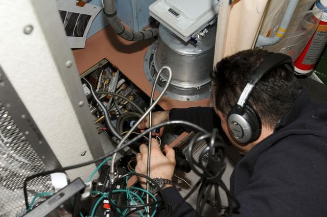 NASA image: Shkaplerov uses a Video Display Unit in the SM