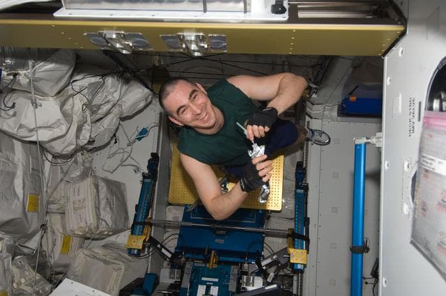 NASA image: Ivanishin enjoys a beverage in the Node 3