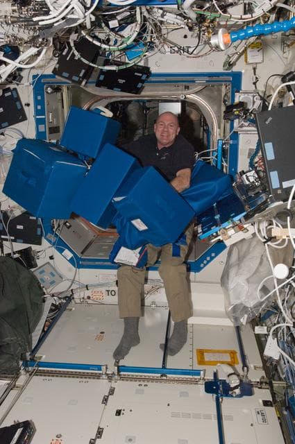 NASA image: Kuipers moves storage containers in the U.S. Laboratory
