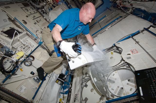 NASA image: Kuipers works at the MELFI-1 in the JPM
