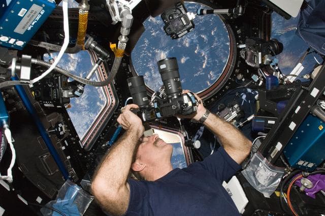 NASA image: Burbank uses still cameras in the Cupola Module