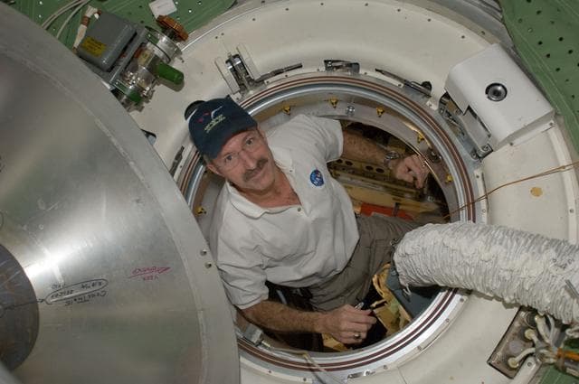 NASA image: Burbank exits the MRM1 hatch area into the FGB Transfer Compartment