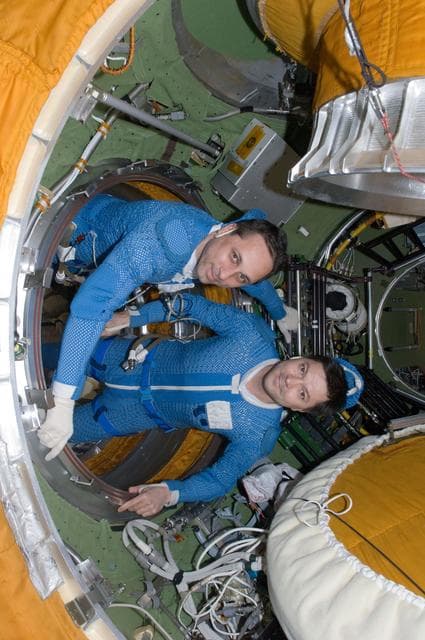 NASA image: Expedition 30 FEs prepare for EVA in the SM Transfer Compartment