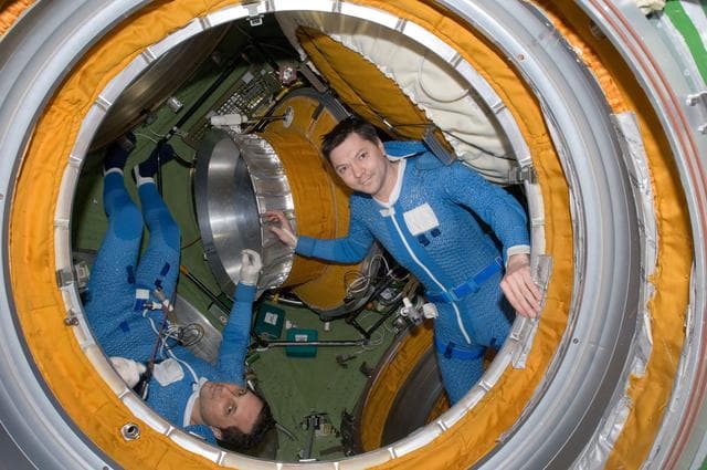 NASA image: Expedition 30 FEs prepare for EVA in the SM Transfer Compartment
