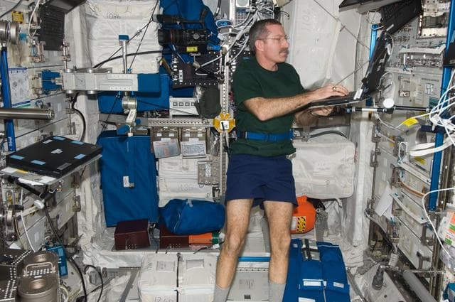 NASA image: Burbank enters High Salt Diet Information in Laptop