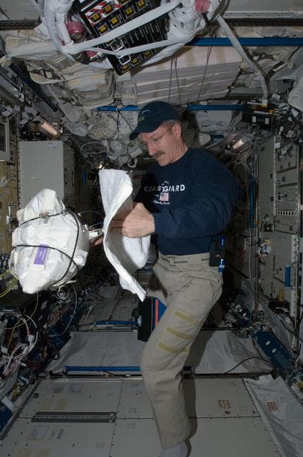 NASA image: Burbank opens a CWC-I Bag
