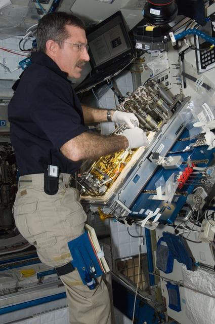 NASA image: Burbank replaces a Catalytic Reactor 2 (CR2)