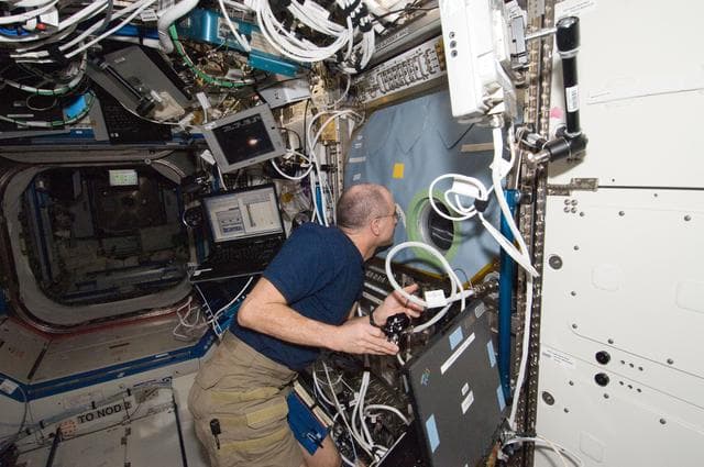 NASA image: Pettit works with the SLICE at the MSG in the U.S. Laboratory