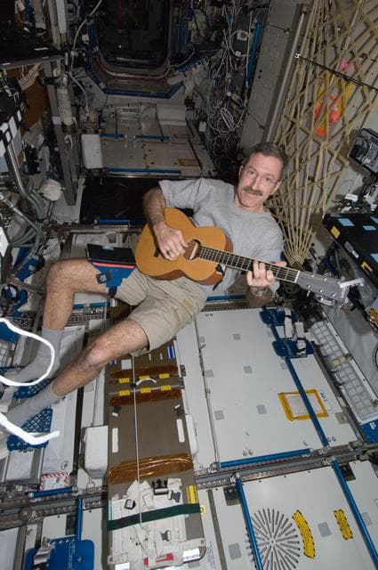 NASA image: Burbank plays guitar in the U.S. Laboratory