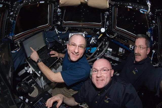 NASA image: Pettit,Kuipers,and Burbank during SSRMS Maneuver in the Cupola Module