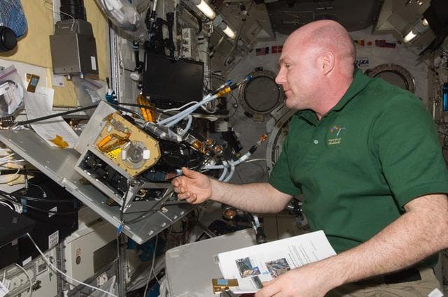 NASA image: Kuipers during replacement of the Marangoni Surface Fluid Dynamics Experiment