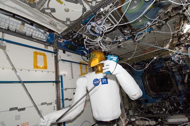 NASA image: Robonaut 2 Humanoid Robot holds instrument to measure air velocity