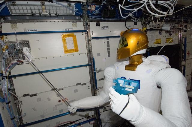 NASA image: Robonaut 2 Humanoid Robot holds instrument to measure air velocity