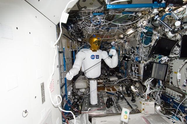 NASA image: Robonaut 2 Humanoid Robot holds instrument to measure air velocity