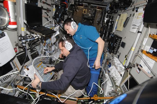 NASA image: Shkaplerov and Kononenko monitor data at the manual TORU Docking System Controls