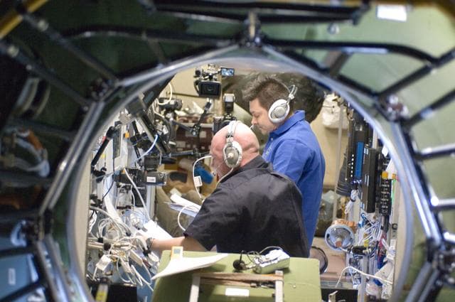 NASA image: Kuipers and Kononenko monitors the approach and docking of ATV-3