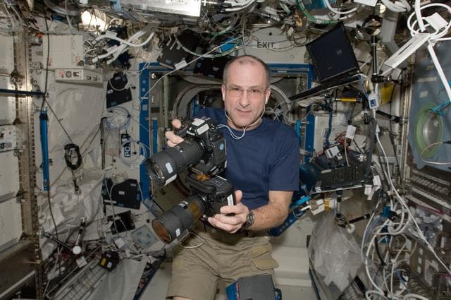 NASA image: Pettit holds cameras in the U.S. Laboratory