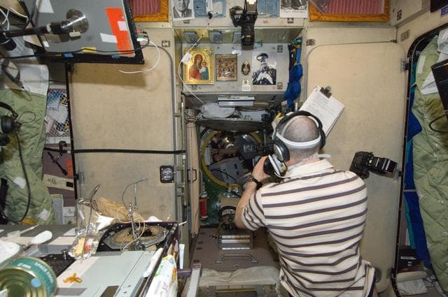NASA image: Ivanishin uses a video camera as ATV-3 hatch opens