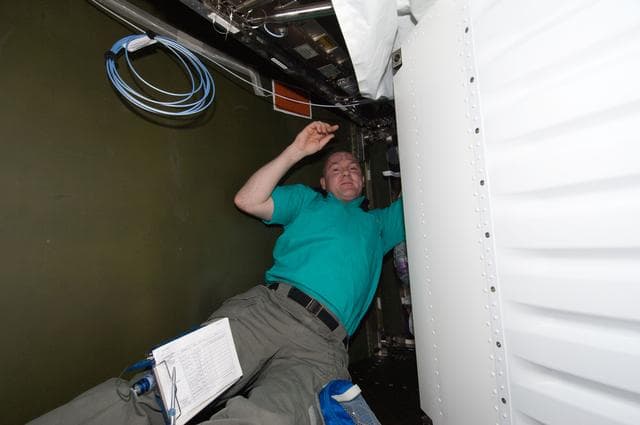 NASA image: Kuipers works on the MDM16C Assembly in the U.S. Laboratory