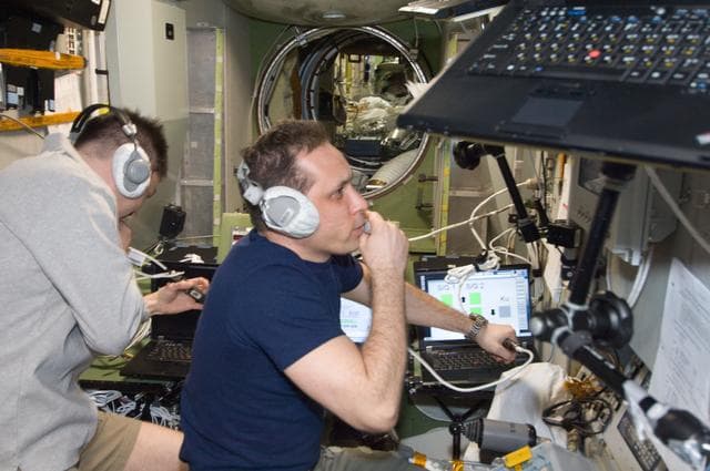 NASA image: Expedition 30 crewmembers use TORU Docking System Controls